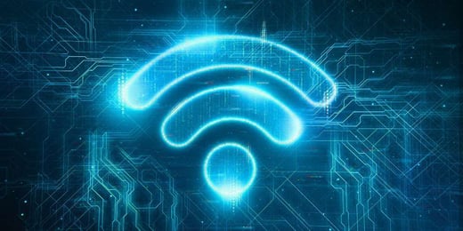 Glowing Wi-Fi symbol over a digital circuit background, representing wireless connectivity and modern network infrastructure.