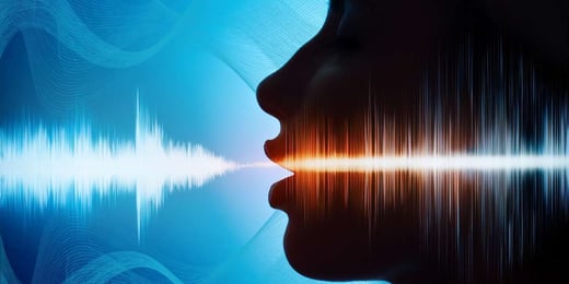 Side profile of a person speaking with digital soundwave visualising voice AI and speech technology.